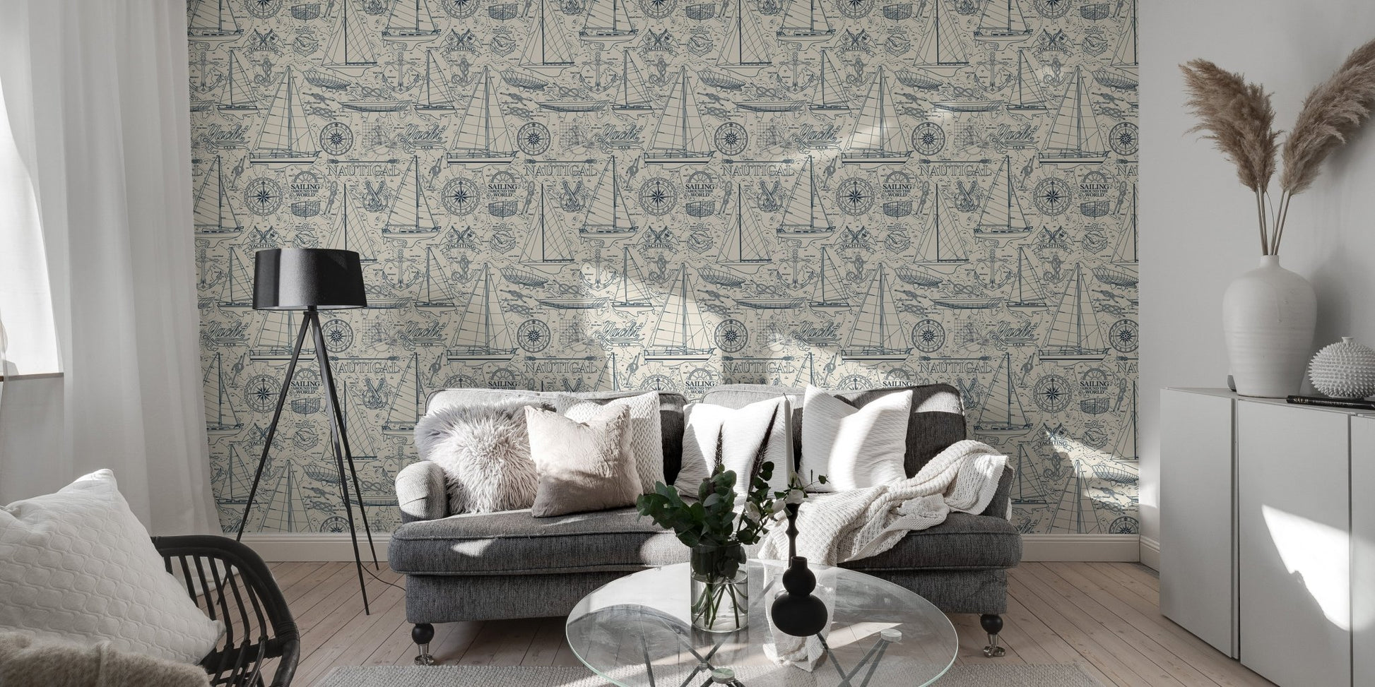 Nautical collage wallpaper behind a grey sofa in a modern living room.