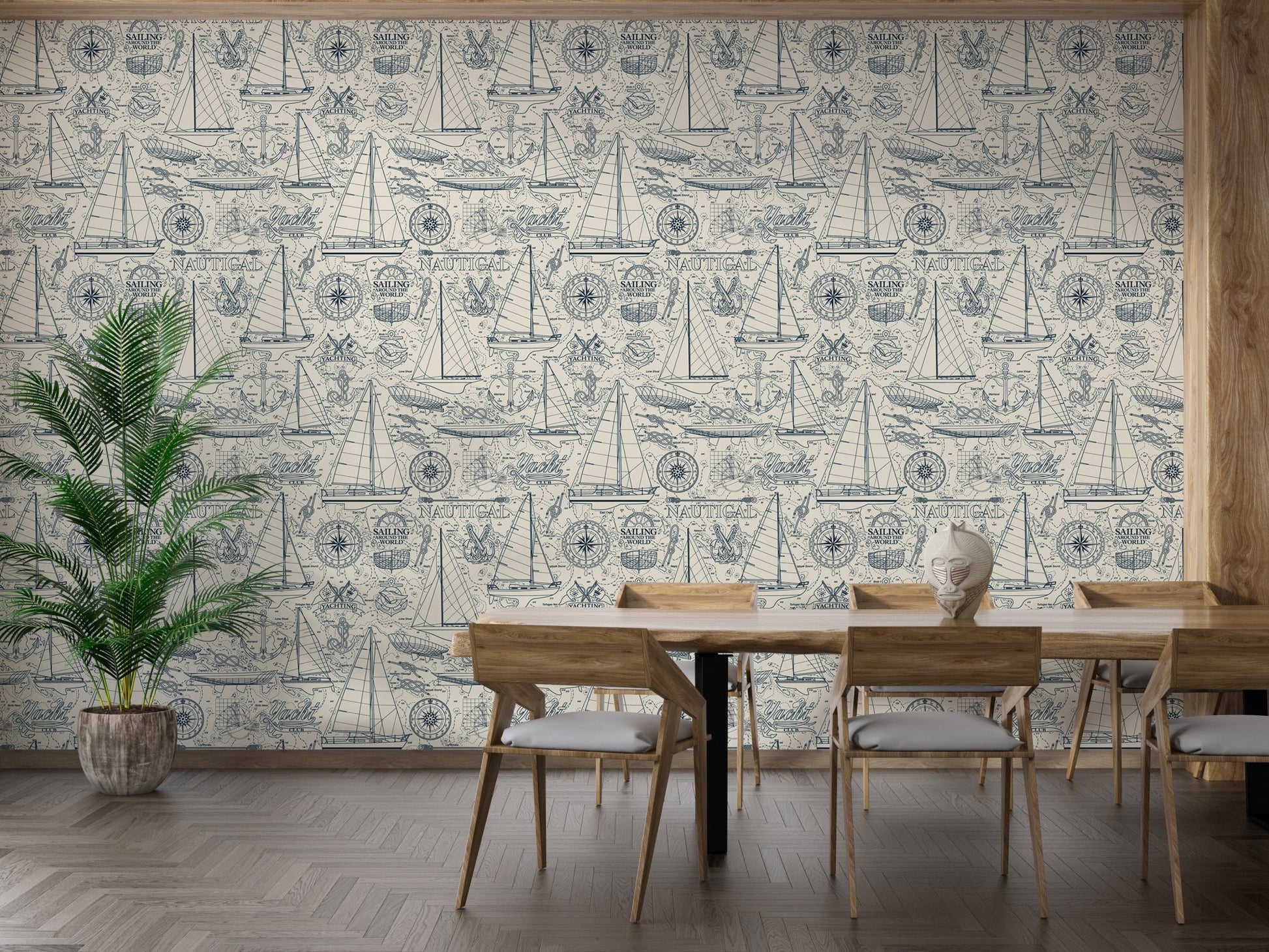 Vintage sailboat wallpaper behind a wooden dining table and chairs.