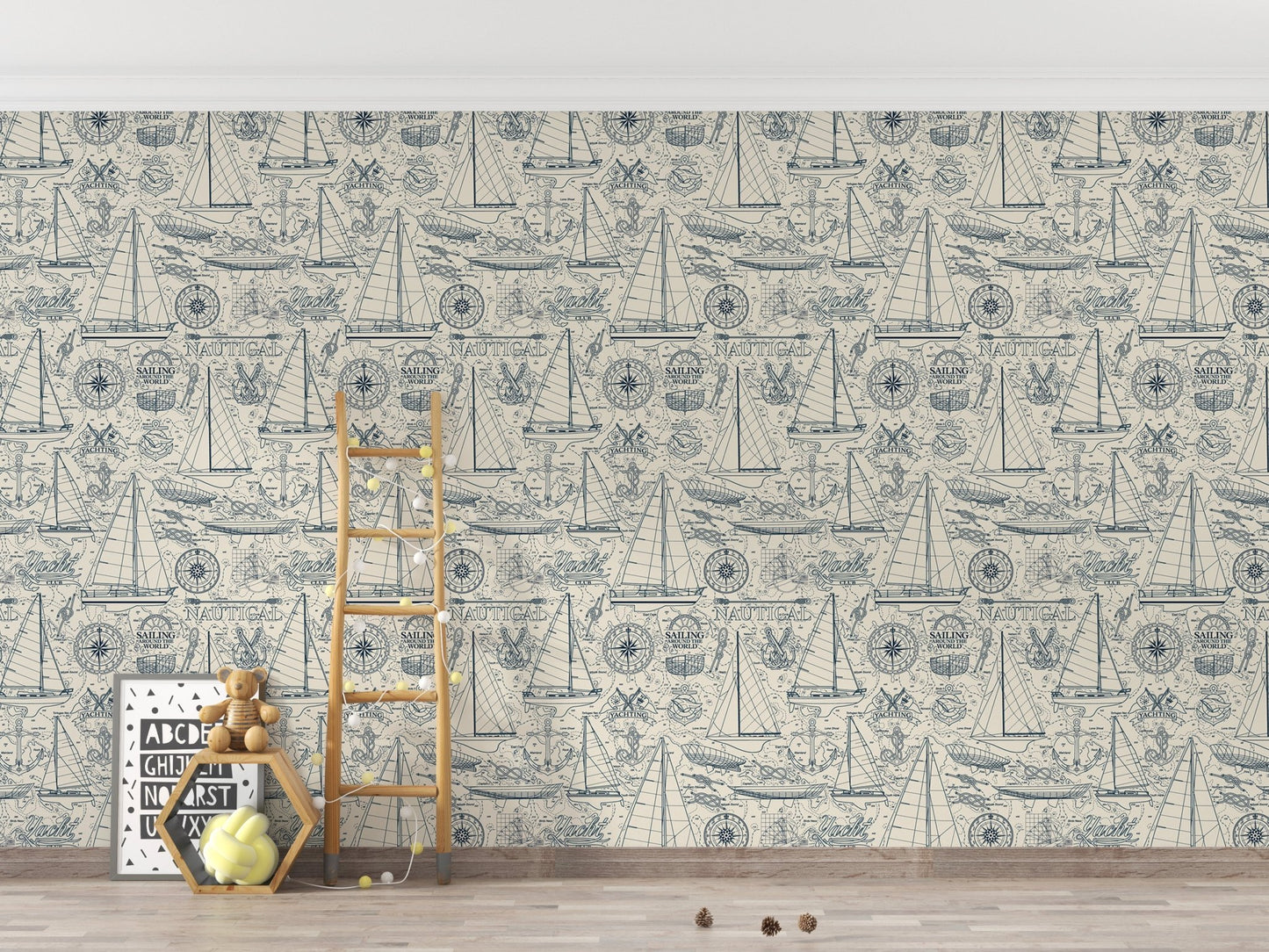 Coastal yachting elements wallpaper in a minimalist playroom with a wooden ladder.