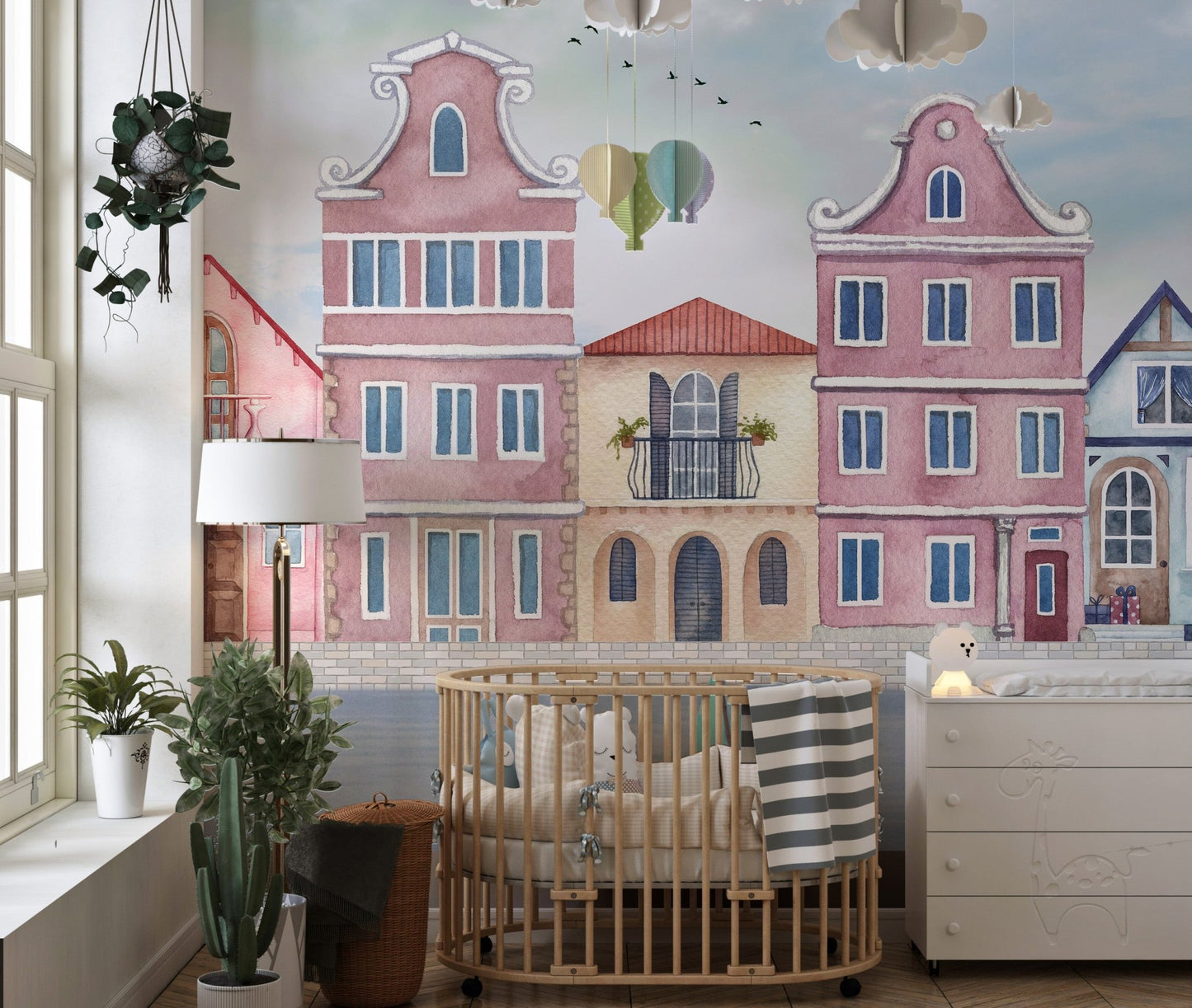 Artistic waterfront houses wall mural in muted coastal color palette.