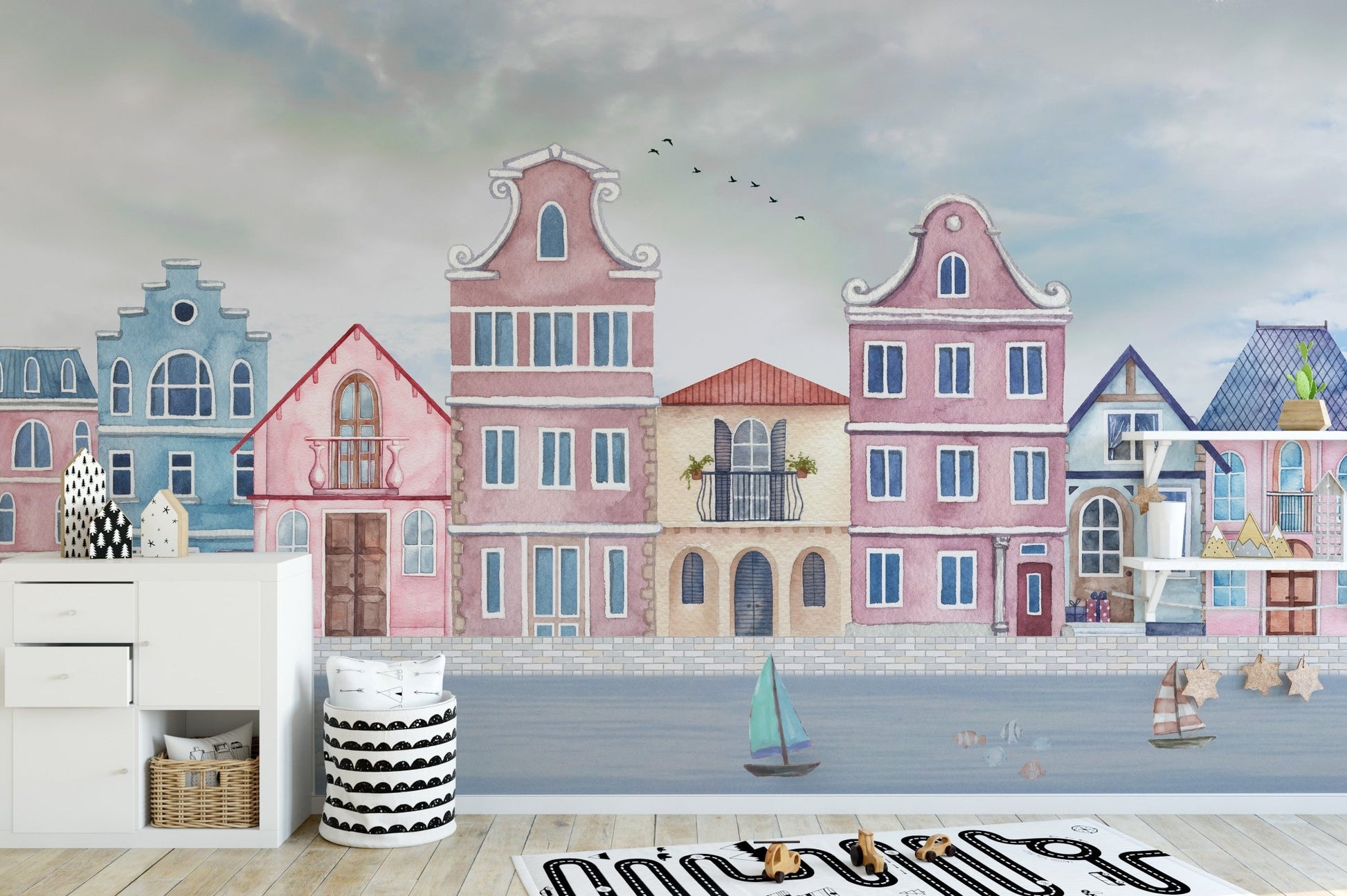 Seaside village wall mural with soft sky and ocean details.