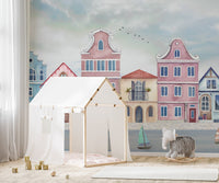 Harbor town wallpaper mural with boats and pastel buildings.