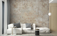 Neutral sepia tone wall mural behind a white sectional couch in a bright room.