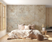 Aged stone texture wall mural in a cozy bedroom with light wood flooring.