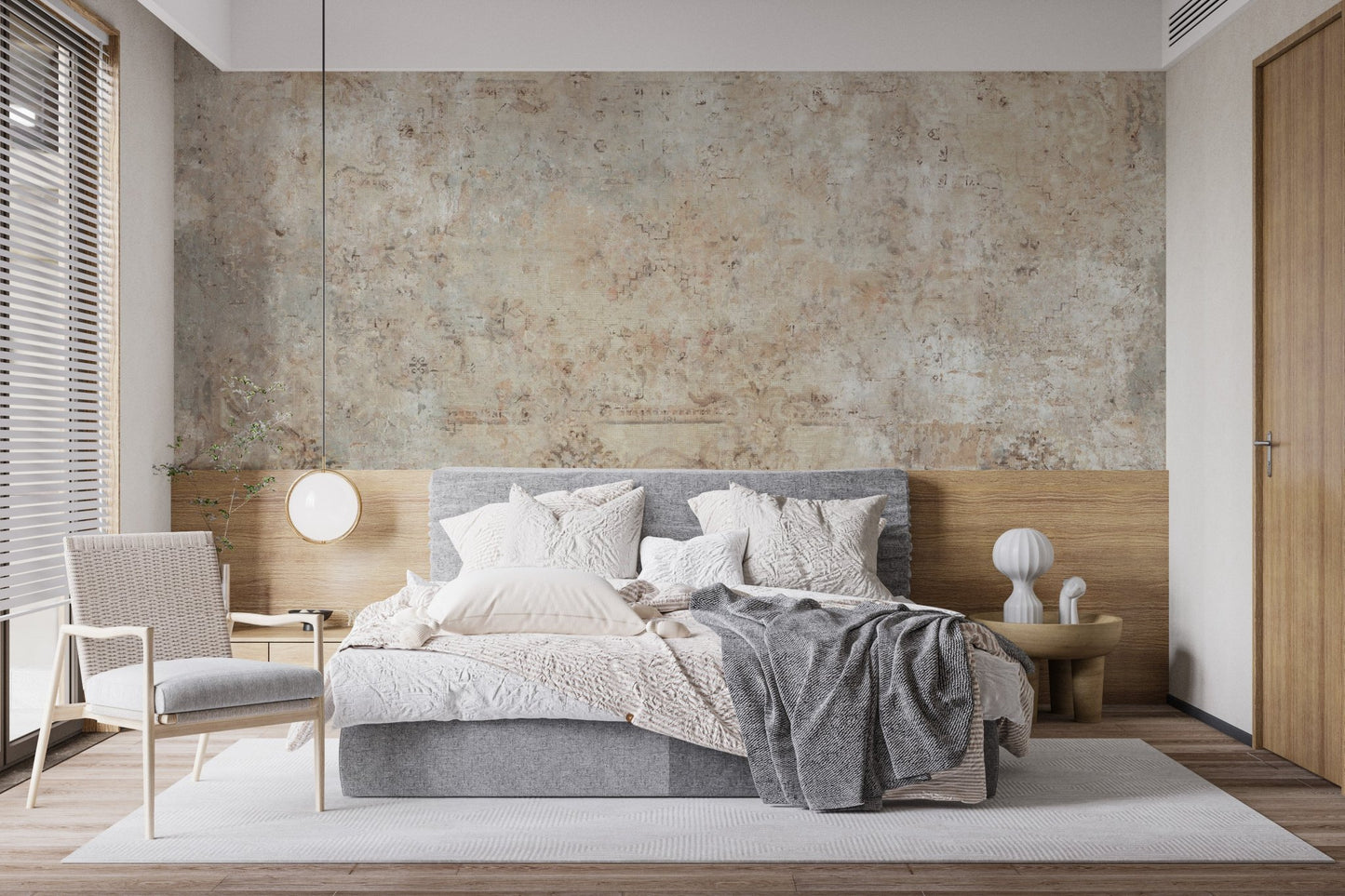 Vintage plaster style wall mural in a bedroom with a low profile wooden bed.