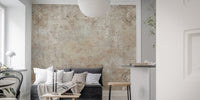 Textured sepia wall mural behind a grey sofa in a modern apartment setting.