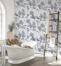Nature inspired pattern wallpaper in a bathroom featuring a white tub and wooden ladder.