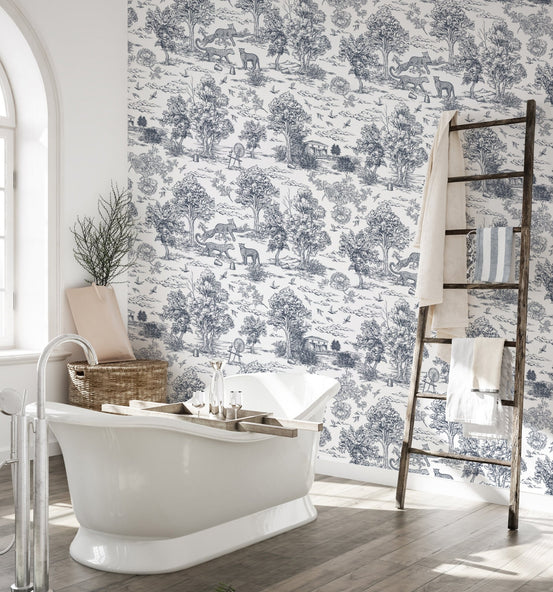 Nature inspired pattern wallpaper in a bathroom featuring a white tub and wooden ladder.