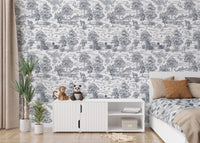 Vintage forest wallpaper in a bedroom with a white cabinet and green plants.