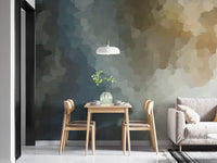 Minimalist dining area with a watercolor wall mural behind a grey sofa.