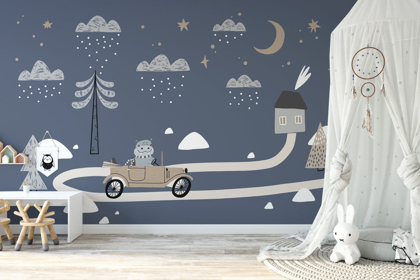 Soft nursery decor featuring a vintage car wall mural.