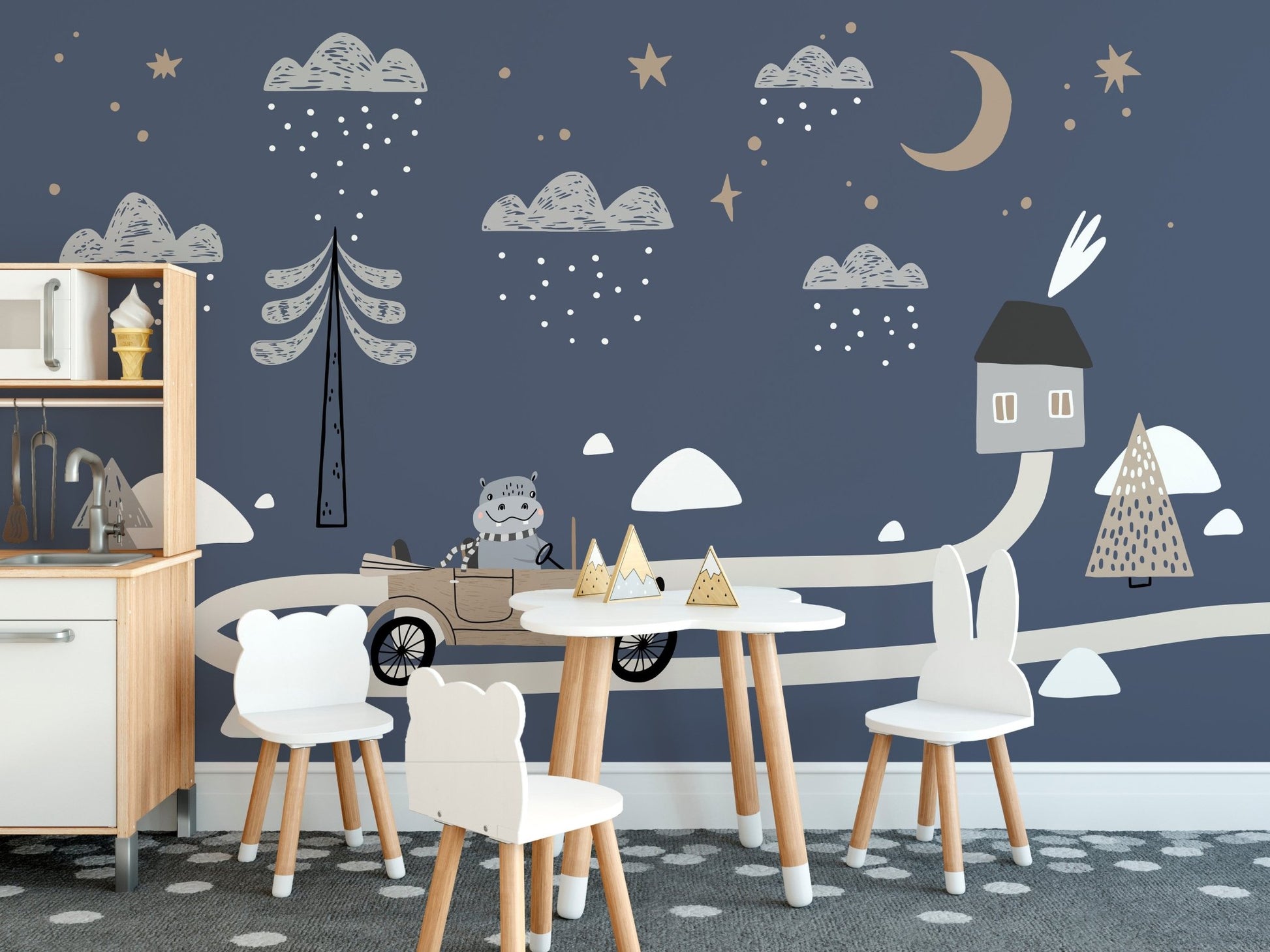 Child's dining area with white chairs and car wall mural.