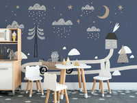 Child's dining area with white chairs and car wall mural.
