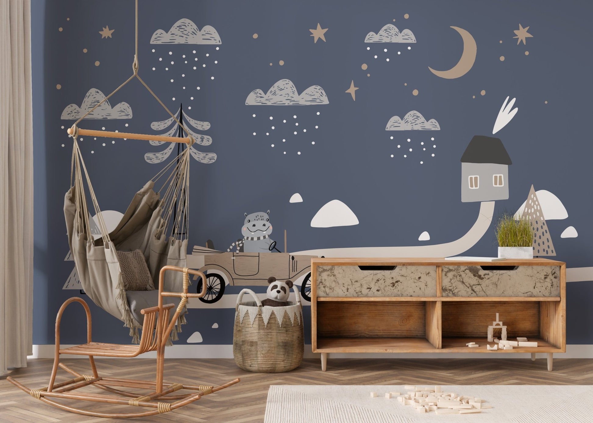White sofa in a playroom with retro car wall mural.