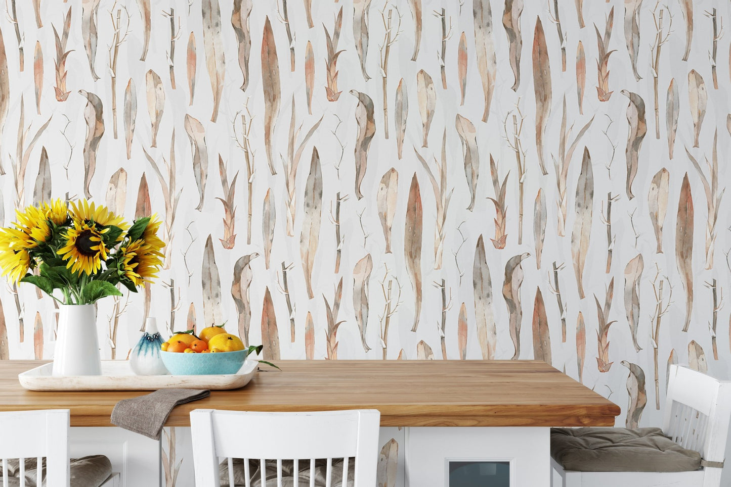 Earthy leaves pattern wallpaper in a dining area with a wooden table.