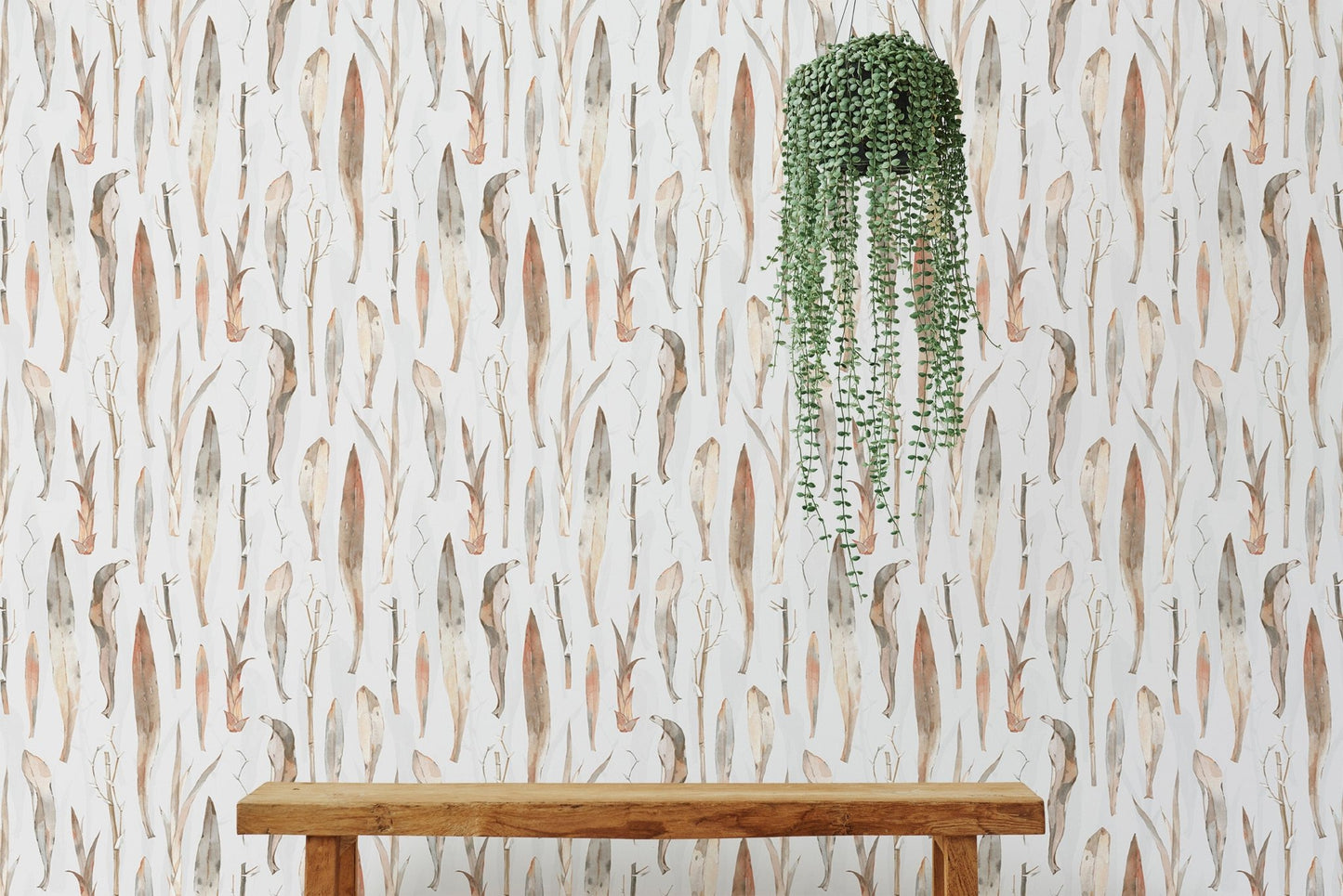 Dry leaves wallpaper styled with a hanging green plant.