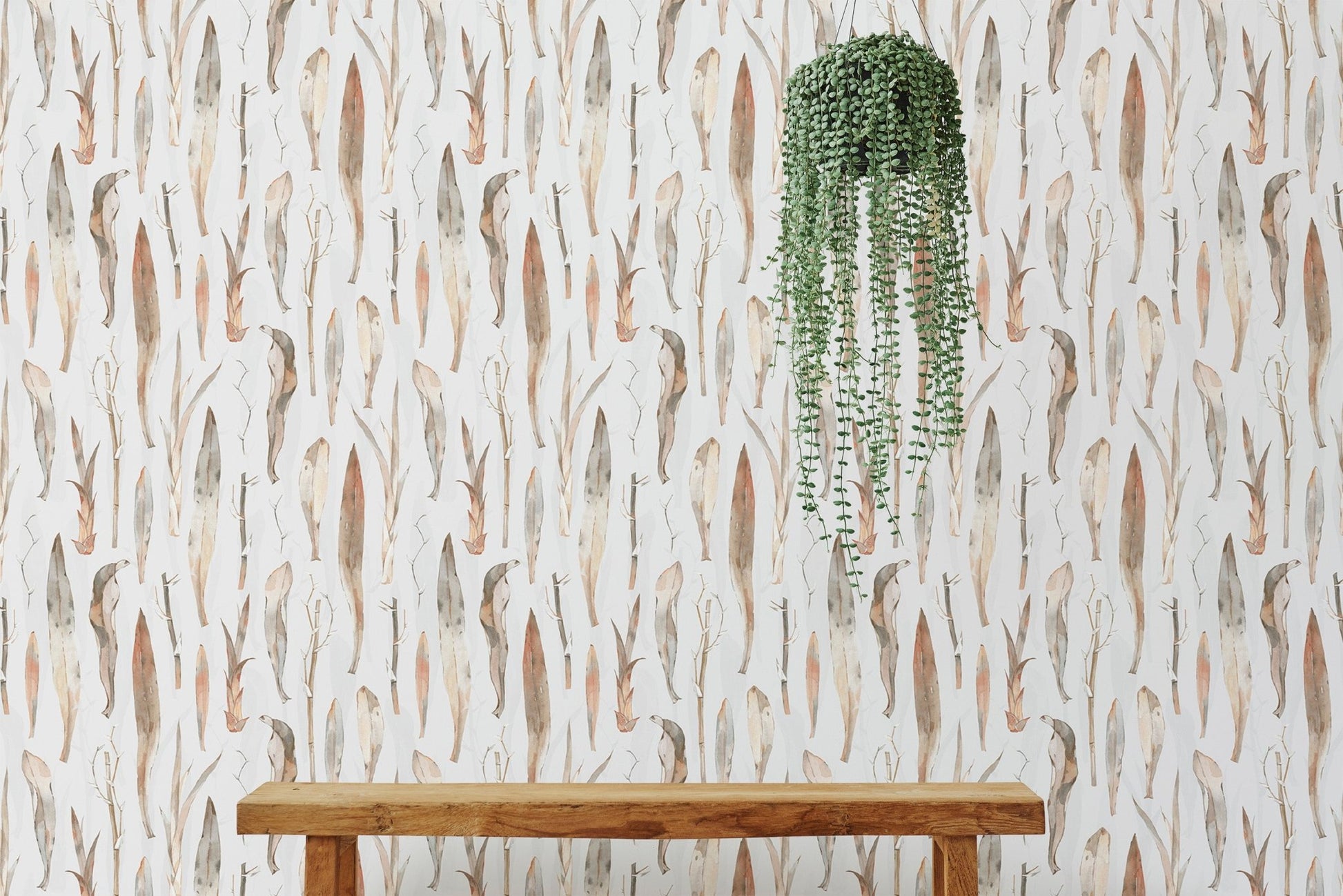 Dry leaves wallpaper styled with a hanging green plant.