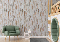 Watercolor dry leaves wallpaper in a nursery with a green armchair.