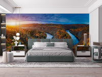 Contemporary bedroom design with a wide river landscape wall mural.