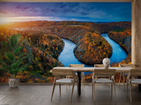 Large landscape wall mural of a river bend in modern dining room.