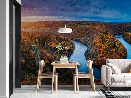Autumn forest mural with Vltava River view in minimalist dining room.