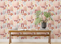 Pastel colored peel and stick wallpaper in a bright hallway with a long wooden bench.