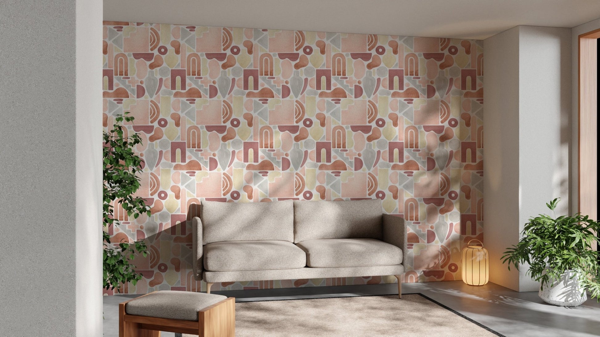 Living area with grey sofa and abstract boho wallpaper reflecting natural sunlight.