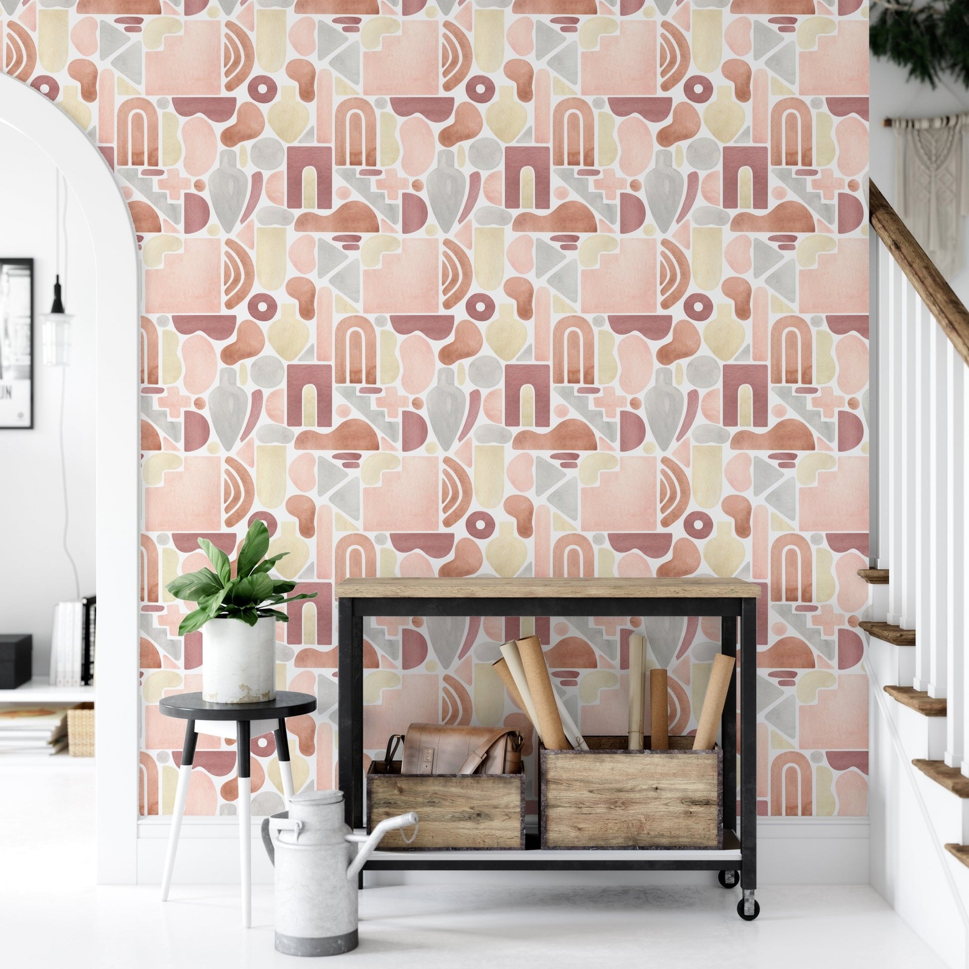 Entryway styling using boho wallpaper behind a black metal shelf and woven baskets.
