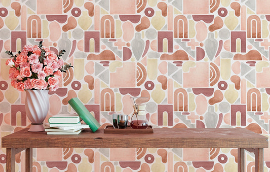 Abstract geometric wallpaper with terracotta arches and pink circles on a living room wall.