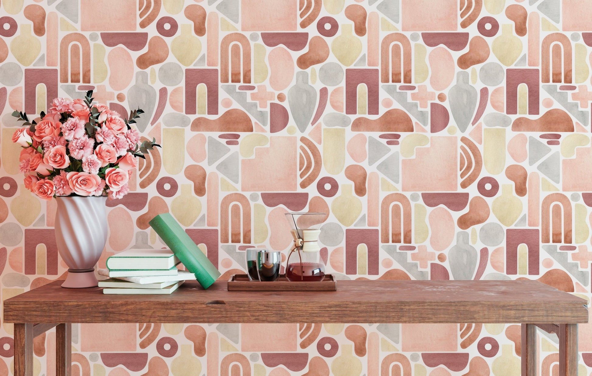 Abstract geometric wallpaper with terracotta arches and pink circles on a living room wall.