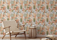 Reading chair and side table positioned near a warm pastel colors wallpaper.