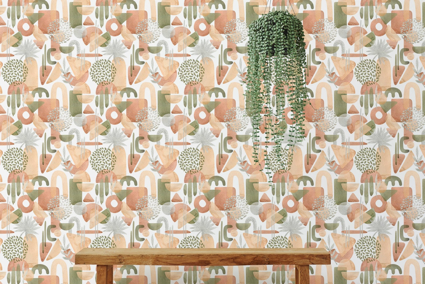 Watercolor abstract shapes wallpaper behind bench and plant.