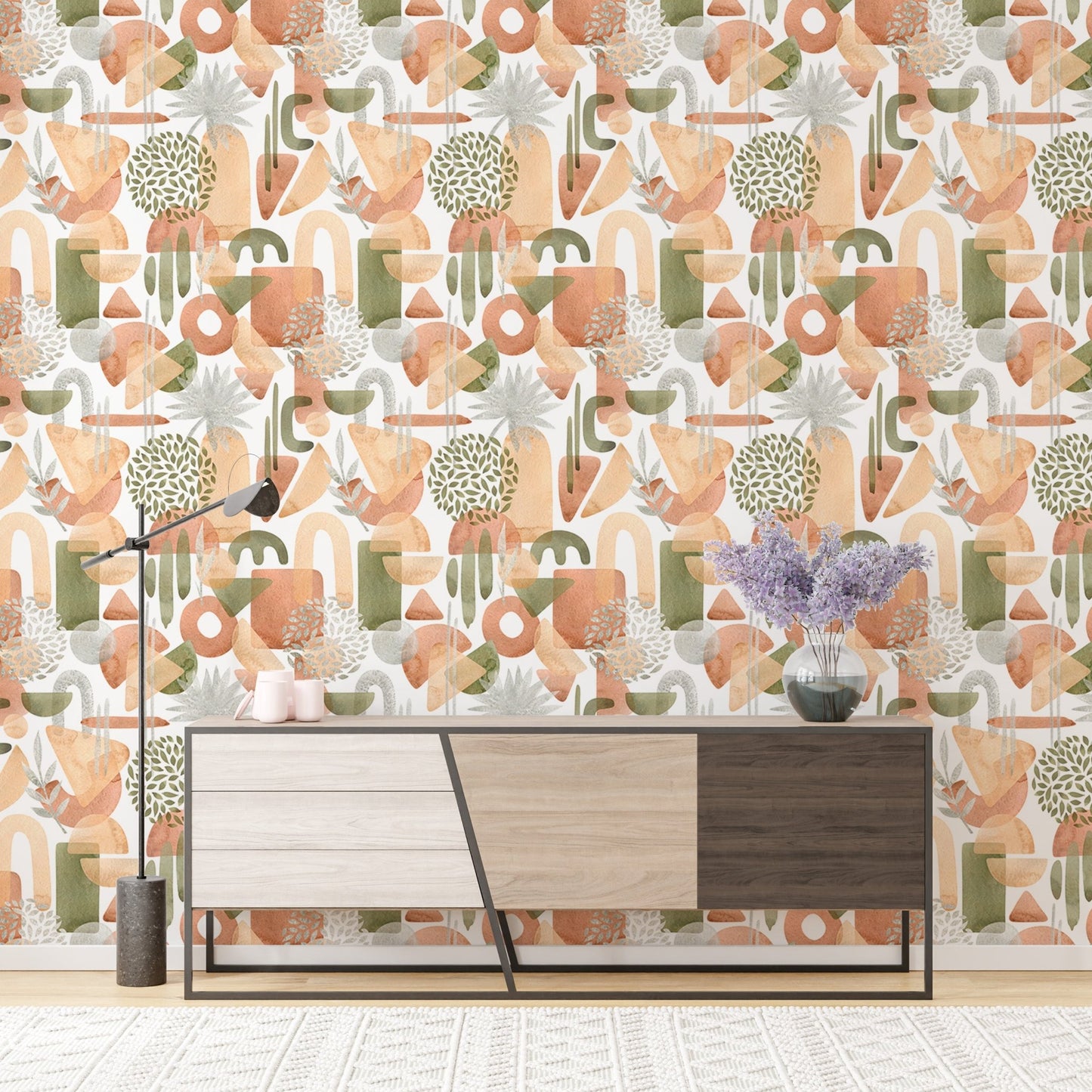 Entryway featuring warm pastel colors wallpaper behind a tri-color console.