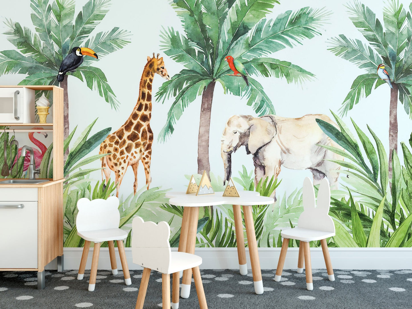 Animal print wall mural for a playroom with small wooden tables and chairs.