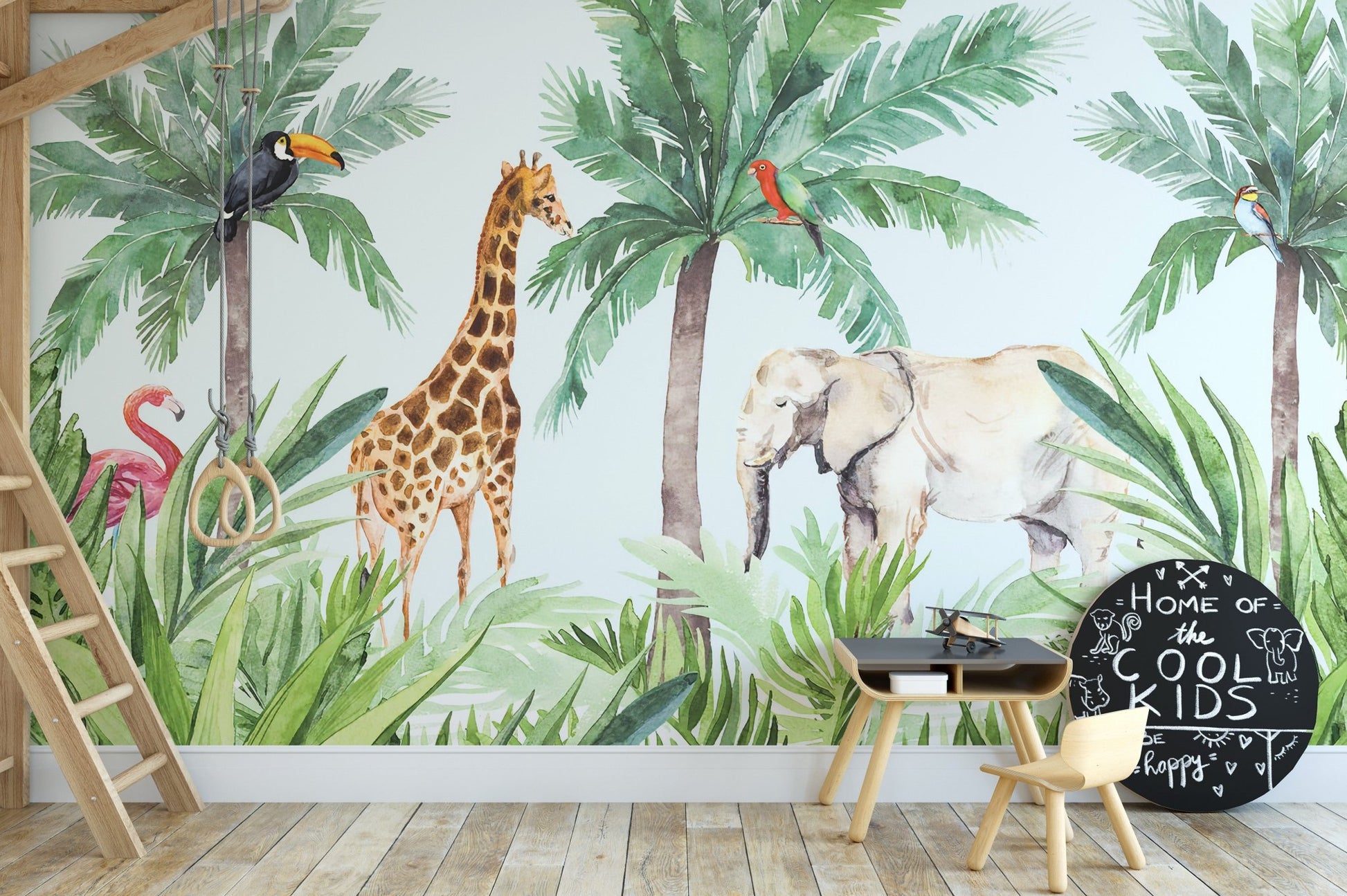 Watercolor animals kids room wall mural behind a wooden study desk.