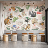 Watercolor beige Monkey & Birds wall mural behind a grey cafe seating bench.
