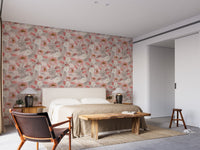 Neutral room decor with a pink and orange blossom wallpaper on a feature wall.