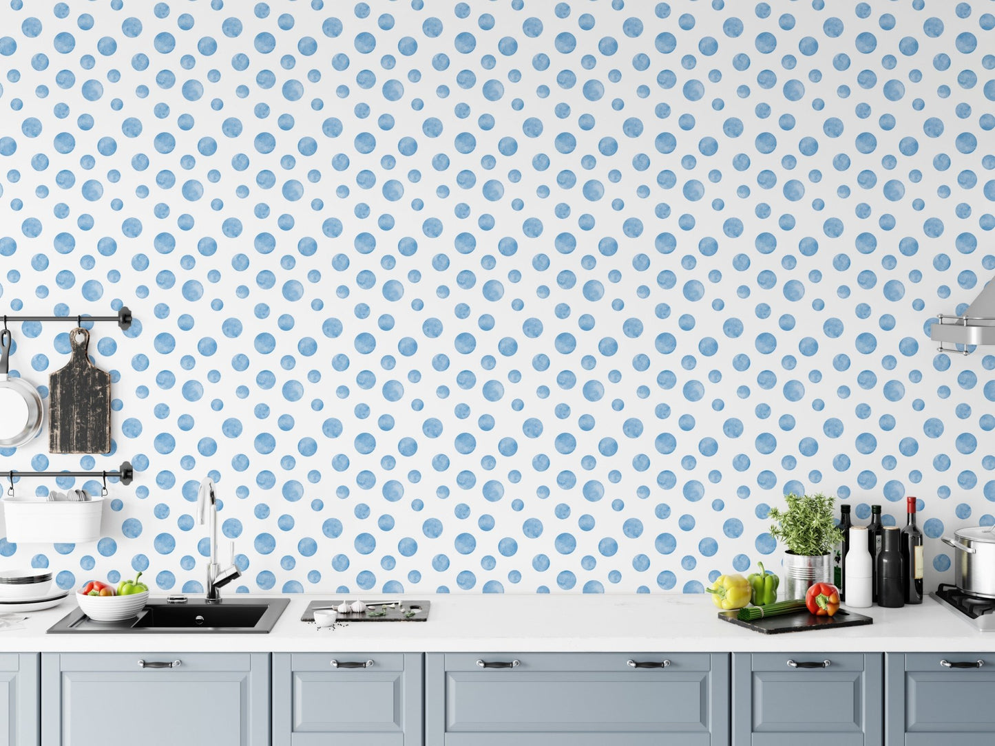Modern kitchen with white cabinets and a blue polka dot wallpaper.