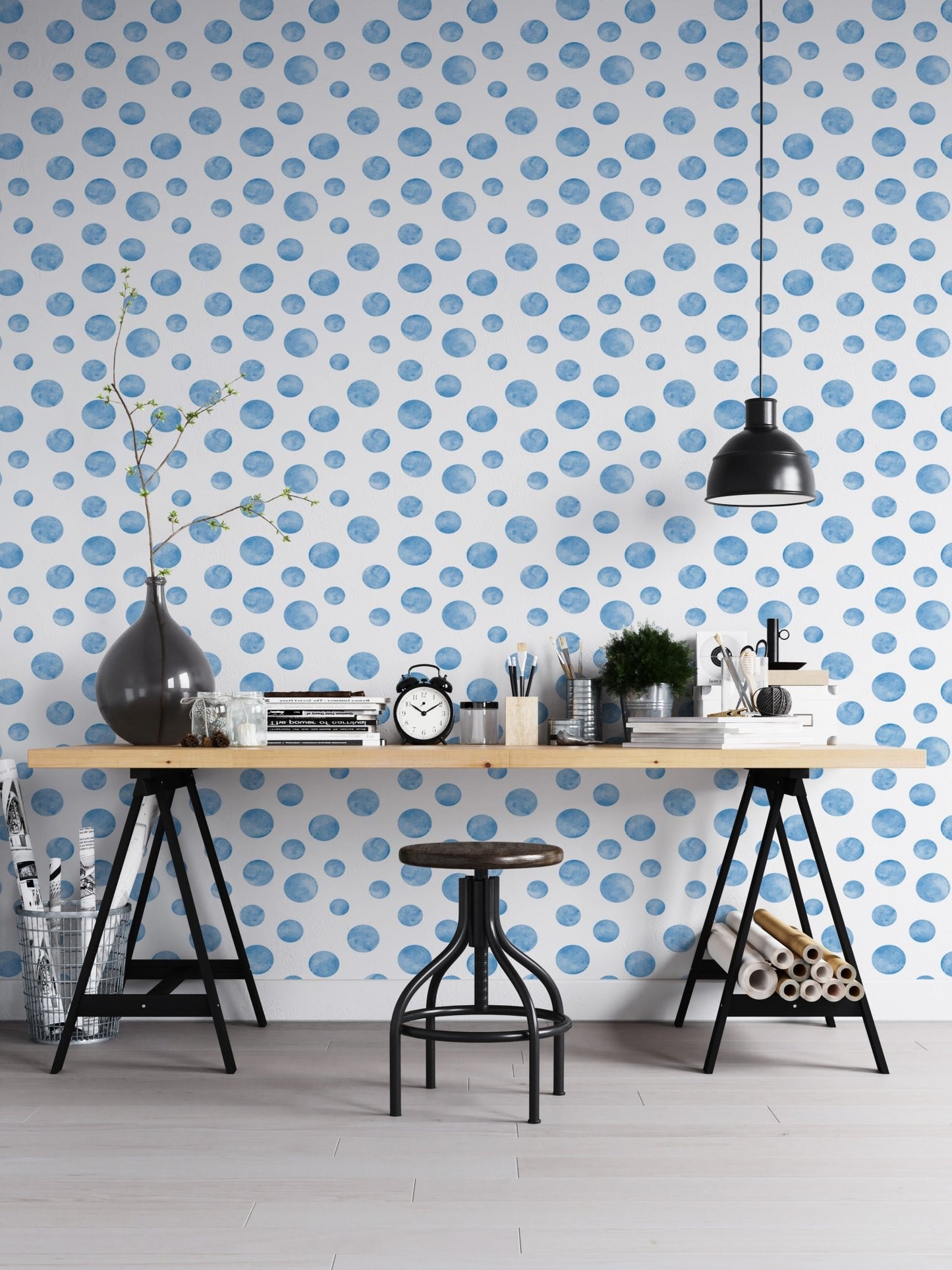 Workspace with a black desk and watercolor blue seamless design wallpaper.
