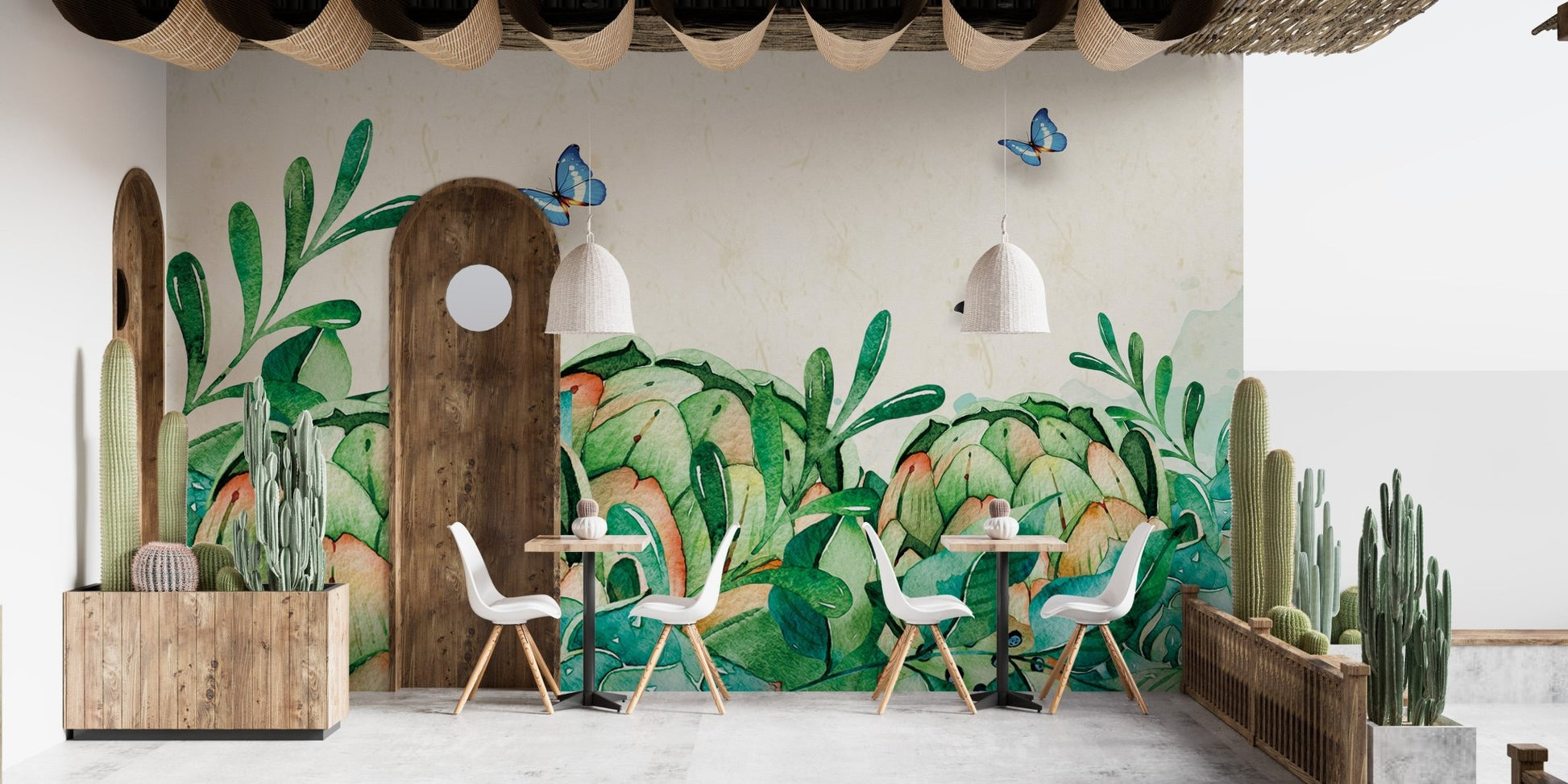 Cafe interior with green botanical wall mural and small dining sets.