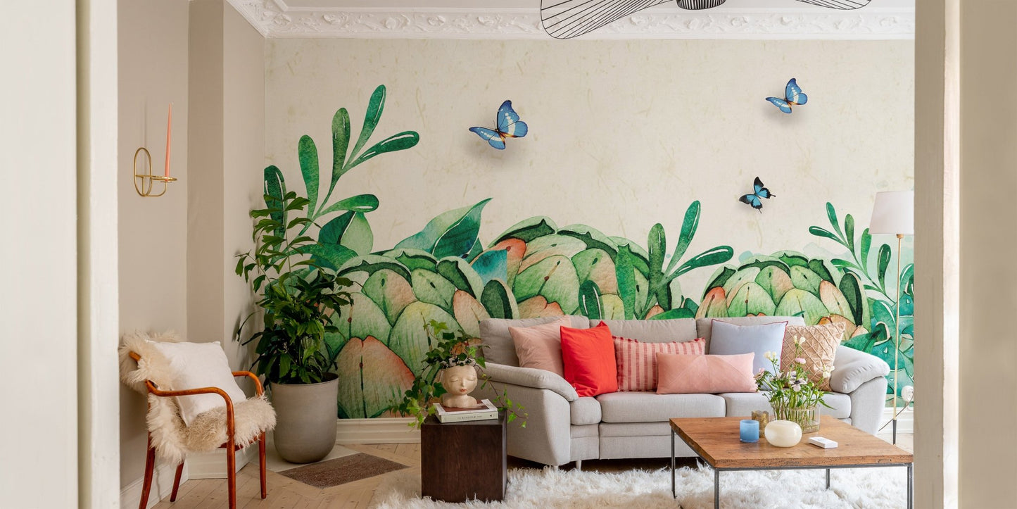 Living room featuring watercolor greenery wall mural and grey sofa.