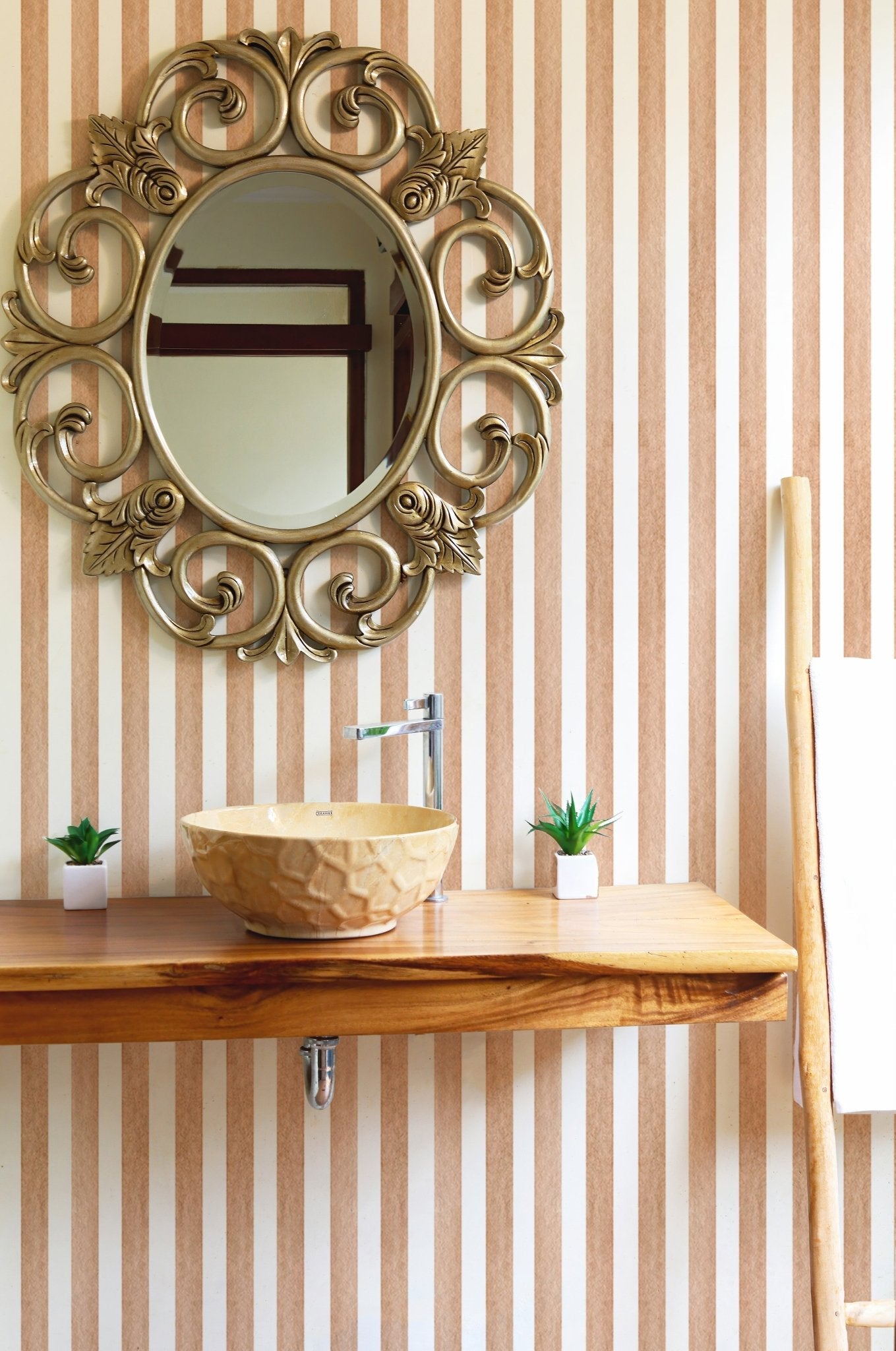 Brown vertical stripes wallpaper behind a bathroom vanity