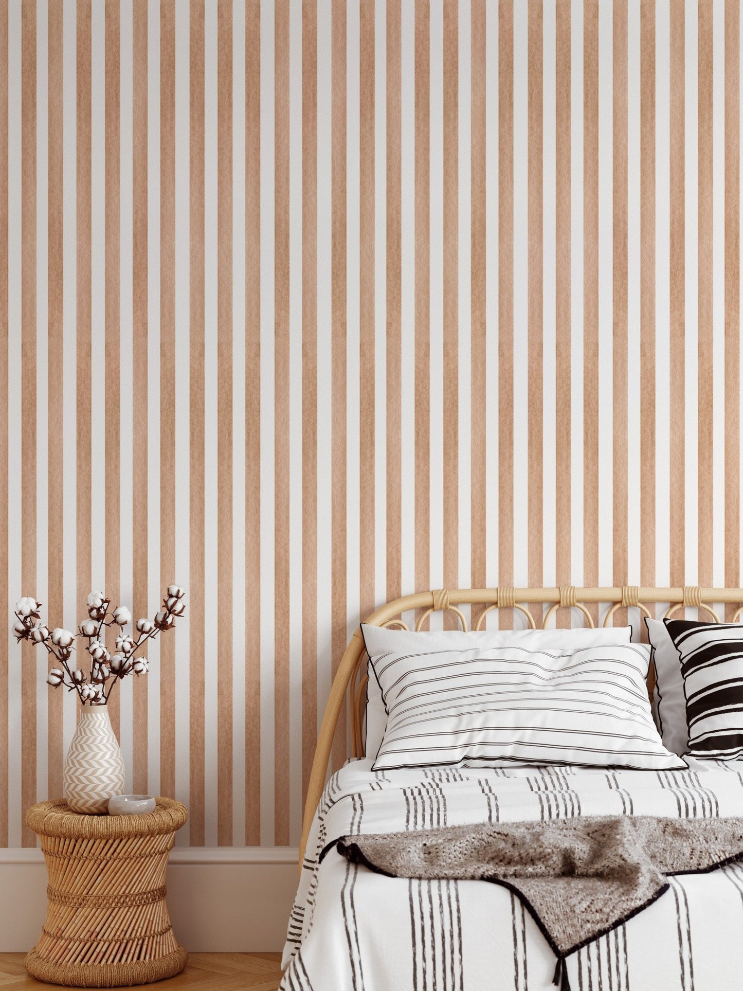 Watercolor brown striped wallpaper behind a single bed in bedroom.