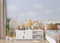 Child's room interior with watercolor city town houses mural on a feature wall.