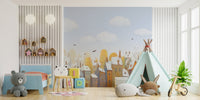 Kids room wall mural with orange and yellow hand-painted houses.
