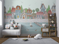 Coastal town wall mural with a grey stone quay and swimming white ducks.