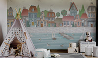 Waterfront cityscape wall mural with rowboats and swans on blue water.