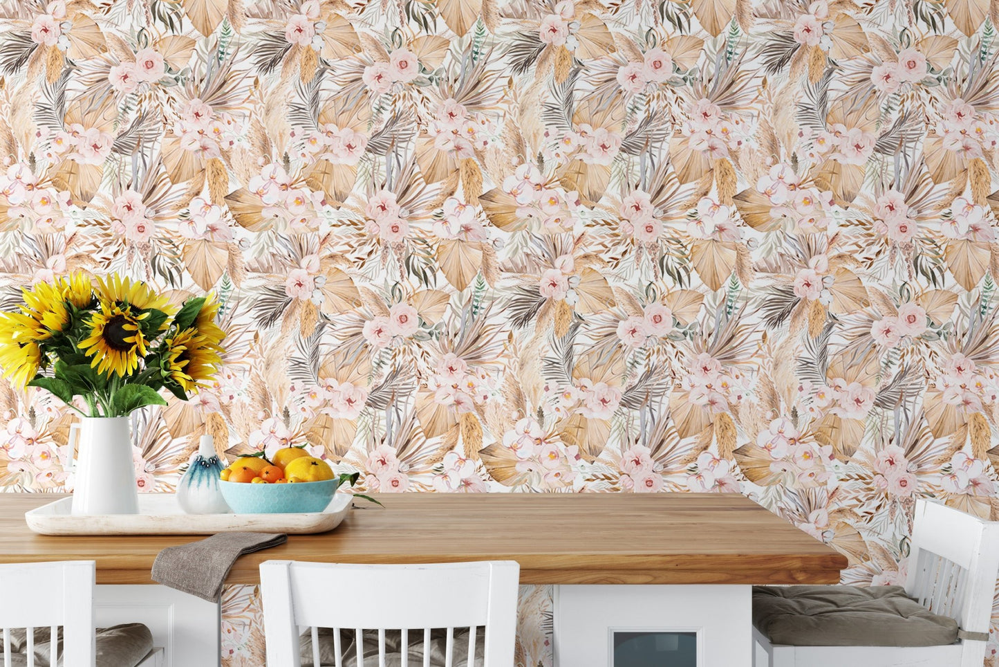 Tropical botanical wallpaper behind wooden dining table with sunflowers and fruit