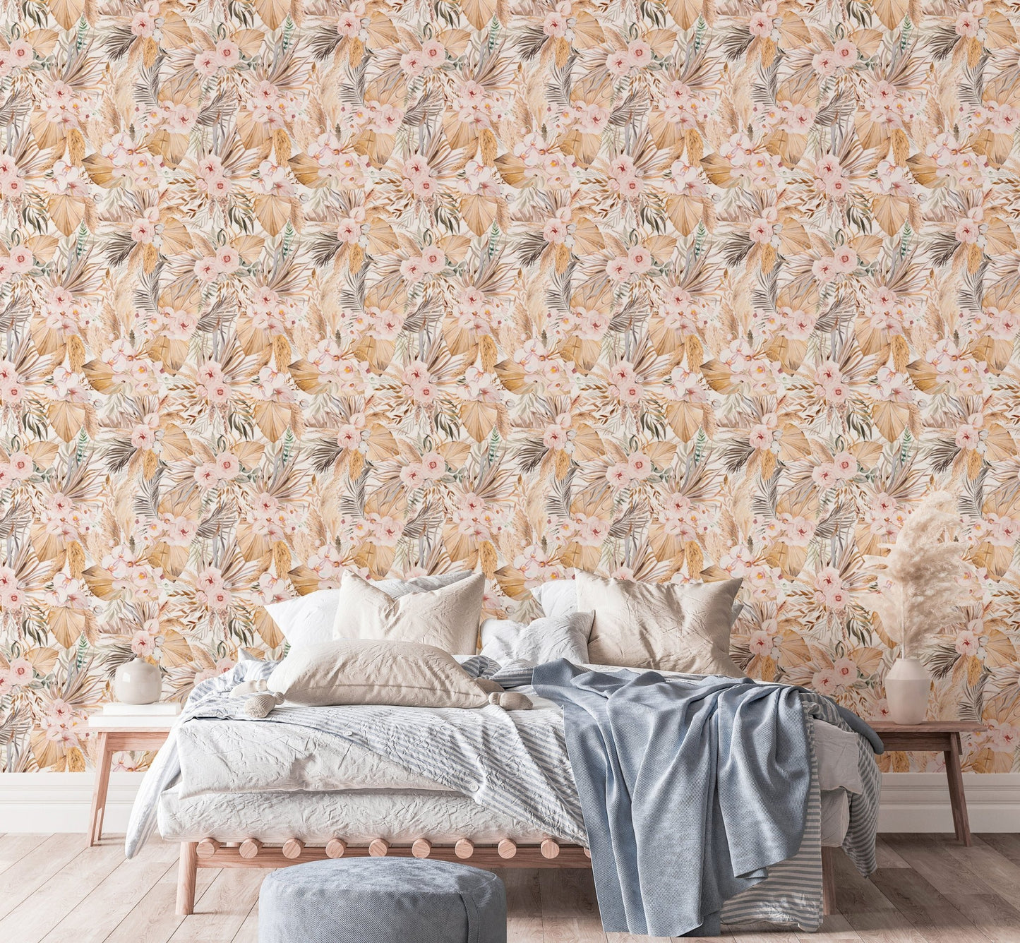 Dried leaf pattern wallpaper in bedroom with light linens and grey pillows