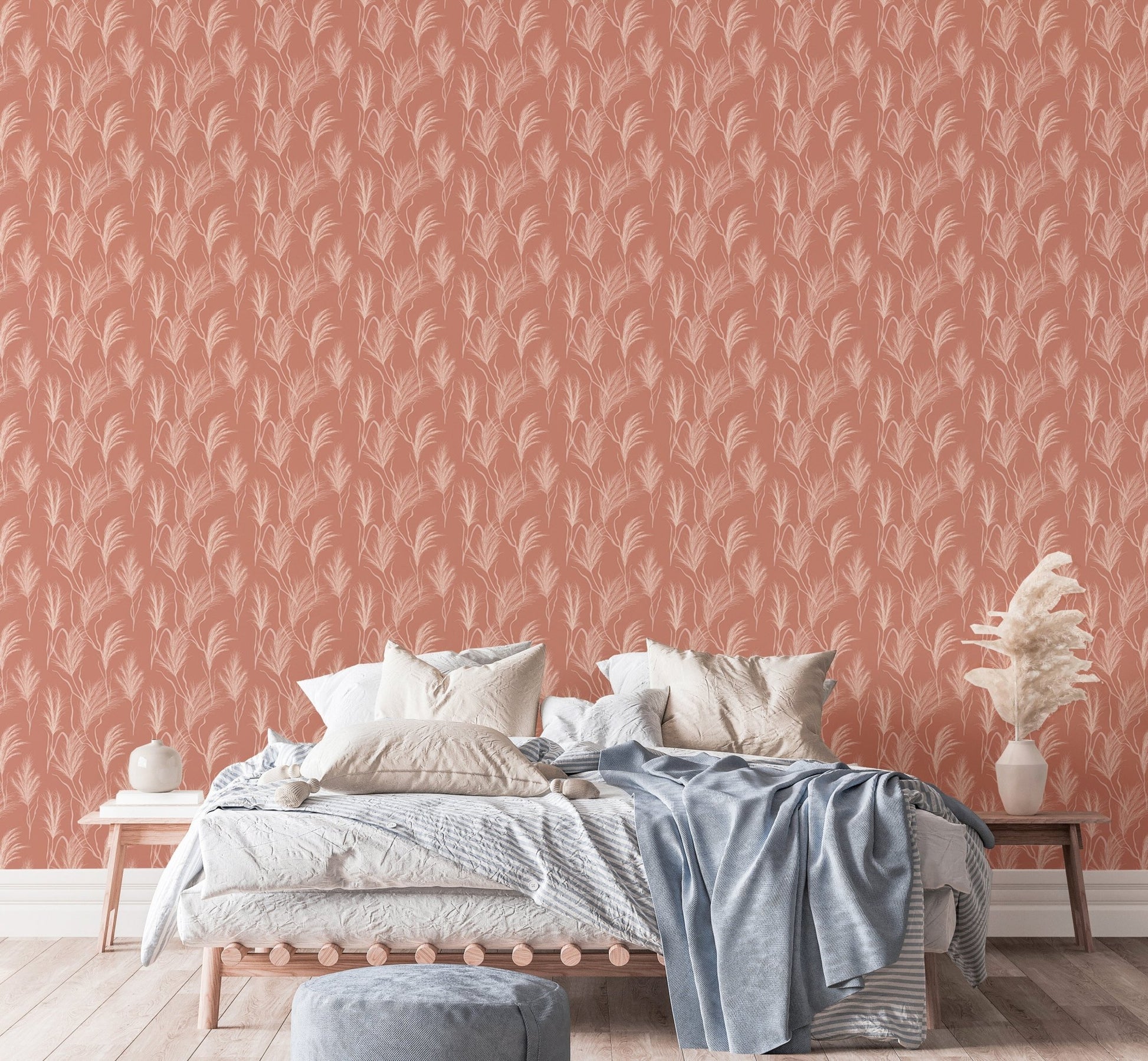 Bedroom with peach botanical print wallpaper and white bedding.